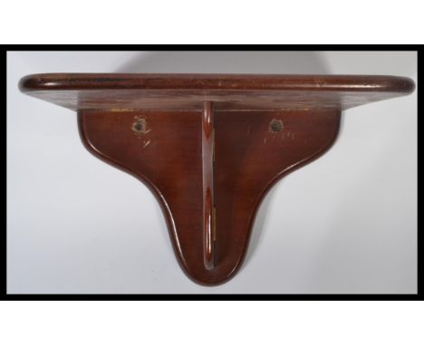 A 19th century Victorian mahogany wall mounted metamorphic drop dowm clock bracket / shelf. Measures 22 cm high, 33 cm wide a