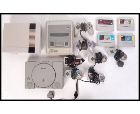 An original PlayStation 1 games console, along with a Nintendo Entertainment System &amp; Super Nintendo Entertainment System
