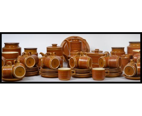 An extensive collection of Hornsea Saffron china from the 1970's to include dinner plates, cups, saucers, casserole dishes et