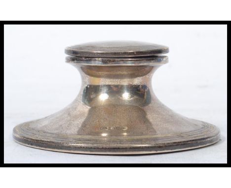 A silver hallmarked Capstan inkwell by Walker &amp; Hall with sheffield hallmarks, date letter illegible. Measures 5.5 cm hig