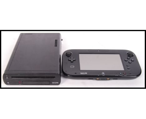 A Nintendo Wii U electronic games console, along with its original handheld system. No cracks to screen. Consoles only, no po
