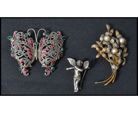A group of three vintage 20th century brooches to include a silver gilt stamped 925 and pearl brooch in jthje form of a bunch