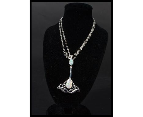 A sterling silver opal art deco style pendant necklace complete in presentation box.