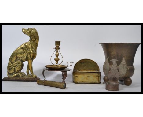 A collection of vintage items dating from the 19th century century include a Victorian heavy cast iron door stop in the form 