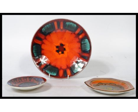 Three pieces of vintage retro Poole pottery to include an Aegean pattern dish and two more dishes of similar period. Largest 