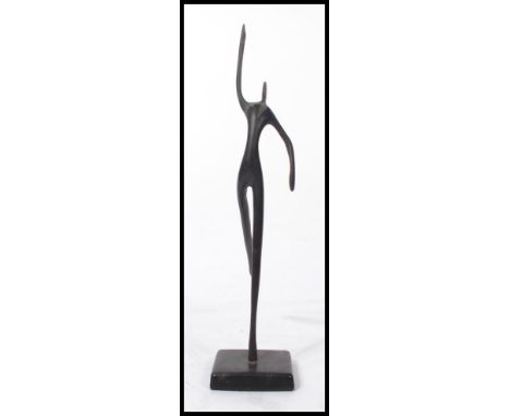 A vintage 20th century Art Deco bronze sculpture of a female dancer set to a square plinth base. Measures 33 cm high.