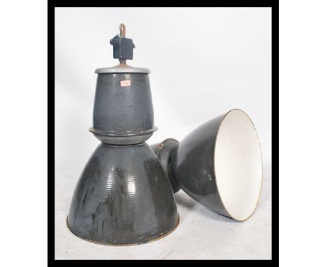 A pair of large vintage industrial 20th century factory black enamel ceiling lights. Each&nbsp; retaining the original fixtur