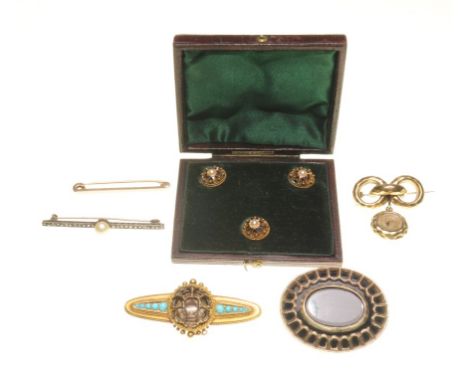 A collection of four brooches
The first, a Victorian 15ct gold and turquoise brooch, with several stone deficient, rope-twist