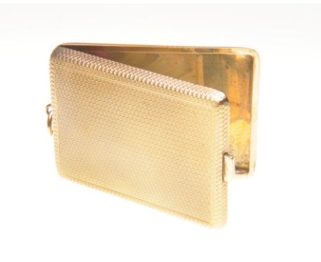 A 9ct gold match case, circa 1920
Of rectangular form, with rounded corners, engine turned decoration, 4.5cm x 6cm, weight 40