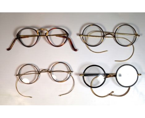 A collection of vintage gold frame spectacles
To include three pairs of gold and faux tortoiseshell wire framed round glasses