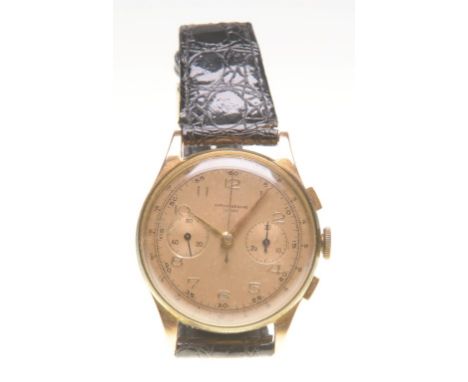 A 18ct gold manual wind chronograph wristwatch, circa 1960s
The champagne coloured dial with applied gold Arabic numbers, tac