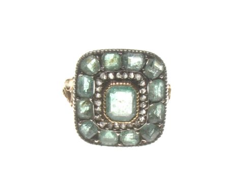 A Victorian emerald and diamond target ring, circa 1850
The central step-cut emerald to a gold collet setting, with a rose-cu