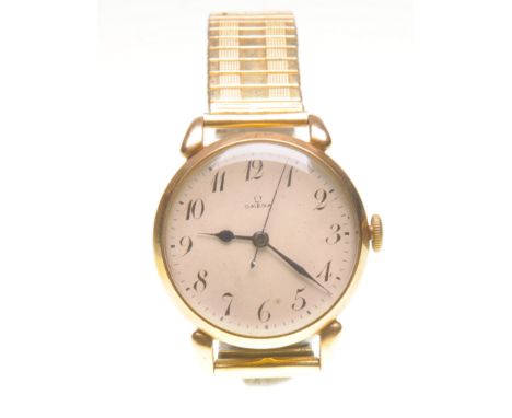 Omega: A 9ct gold manual wind wristwatch
The cream dial with black Arabic numbers, outer printed five minute divisions, blue 