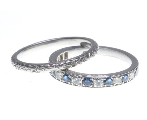 A sapphire and diamond half hoop eternity ring
Set with alternating circular-shaped sapphires and round brilliant-cut diamond