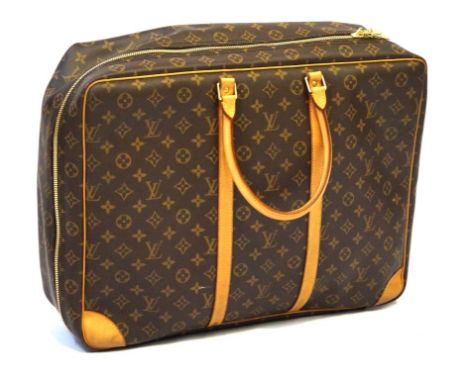 A Louis Vuitton Sirius 45 monogrammed travel suitcase/bag 
The monogrammed canvas with tan leather straps and twin folded han