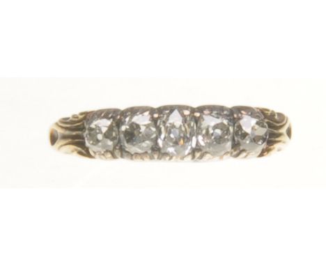 A Victorian diamond five stone ring
Set with graduated old brilliant-cut diamonds, to a silver and yellow metal setting, tota