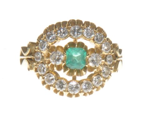 An emerald and diamond dress ring
The step-cut emerald, set centrally flanked by two brilliant-cut diamonds to an open work r