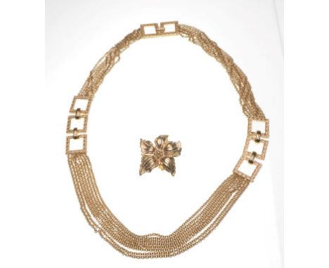 Christian Dior: A gold tone waterfall chain necklace 
Set with engraved square links, connected with eight graduated chains, 