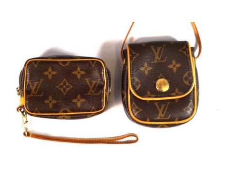 Two Louis Vuitton monogram travel accessories 
To include a digital camera case, with central upper zip and tan leather hand 