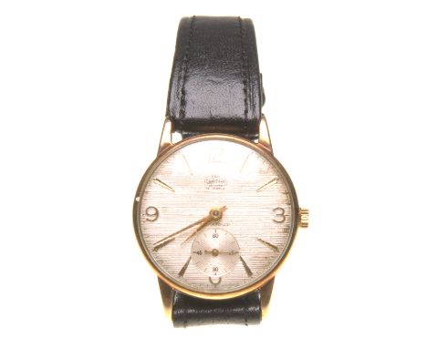 Smiths: A 9ct gold manual wind presentation wristwatch
The champagne coloured textured dial with applied baton and Arabic num
