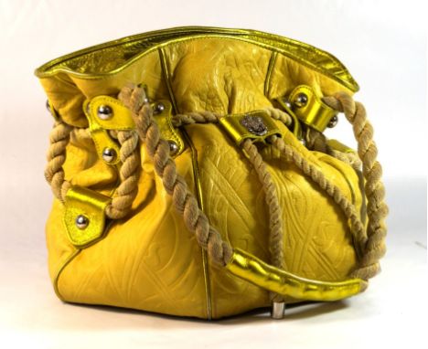 A vintage Liberty 'Pumpkin' tote handbag 
The lime green leather handbag, with vibrant leather studded straps and shiny green