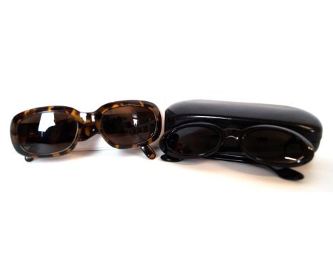 Two pairs of designer sunglasses 
To include a pair of black framed cateye sunglasses, with original box, together with a pai