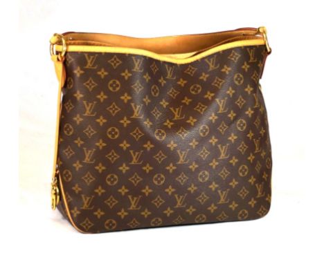 A Louis Vuitton monogram 'Delightful MM' tote handbag
Of rectangular form with tan leather piping and shoulder strap, with ci