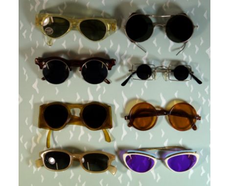 A collection of vintage sunglasses 
To include eight various examples including two brown framed rounded examples, three vari