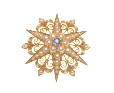 A sapphire and pearl star brooch/ pendant
The central cluster with an oval-shaped sapphire to a half pearl surround, set with