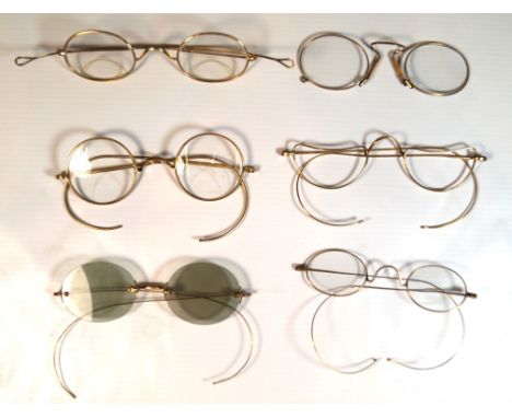 A collection of vintage yellow metal spectacles and pince-nez
To include five pairs of yellow metal circular wire-framed spec