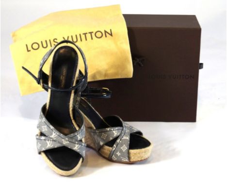A pair of Louis Vuitton Majorca wedge sandals in Monogram Idylle
The espadrille type sandal with dark blue and white fabric u