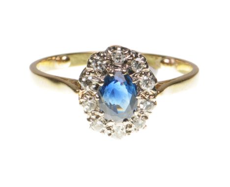 A sapphire and diamond cluster ring
The oval mixed-cut sapphire to a round single-cut diamond surround, stamped 18ct, total d