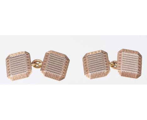 A pair of 9ct gold cufflinks
Of rectangular form with canted corners and engine turned decoration, hallmarked, to original ca