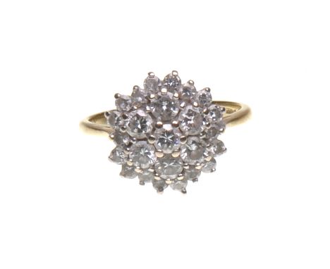 A diamond cluster ring
The seven centrally set brilliant-cut diamonds, each approximately 0.10ct, to a smaller brilliant-cut 