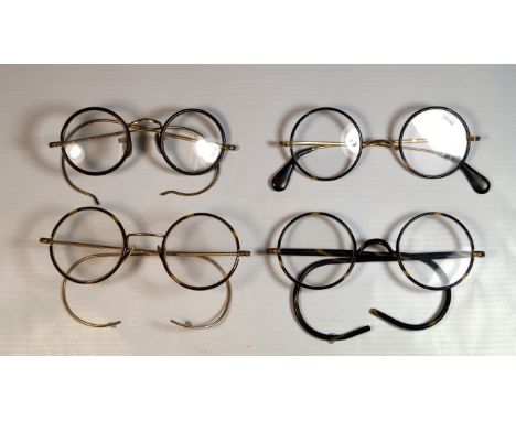 A collection of four pairs of vintage spectacles 
All pairs with circular faux tortoiseshell wire frames with yellow metal ar