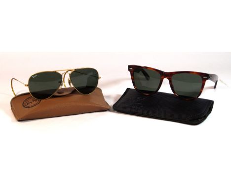 Two pairs of vintage Ray-Ban Bausch & Lomb sunglasses
To include a pair of tortoiseshell wayfarer sunglasses, 13cm wide,  and