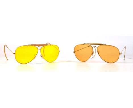 A pair of Vintage Ray-Ban Bausch & Lomb 'Outdoorsman Bullet hole Kalichrome shooters'
The yellow metal wire frame featuring B