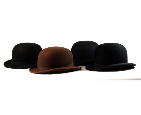 A collection of vintage black felt bowler hats 
To include three black felt examples with ribbon detail, two sized 6 5/8 and 