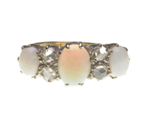 An opal and diamond dress ring
The oval cabochon-cut opals, interspaced by rose-cut diamonds, to a claw setting, ring size L 