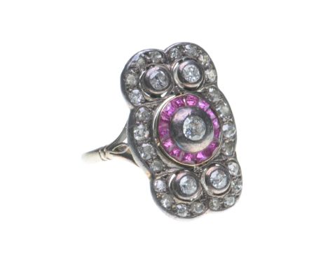 An early 20th century synthetic ruby and diamond panel ring
Centering a round old-cut diamond, to a calibre-cut ruby surround
