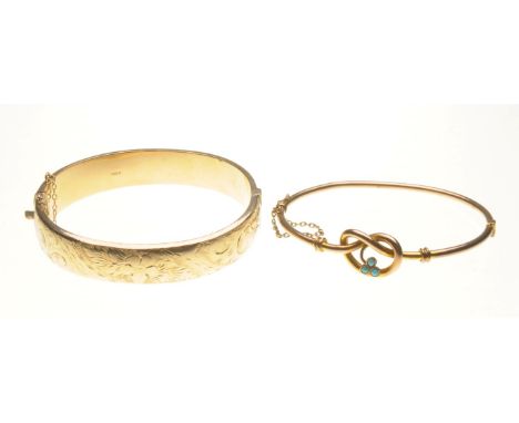 An early 20th century turquoise set bangle
The turquoise set in the form of a clover centering a knot shape, stamped 9ct, len