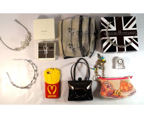 A collection of various designer collectible items 
To include a Moschino mobile phone cover,  an Edinburgh crystal small dre