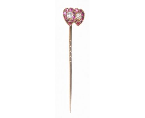 A late 19th century ruby and diamond set double-heart stick pin
Each heart centrally set with an round old-cut diamond, to a 