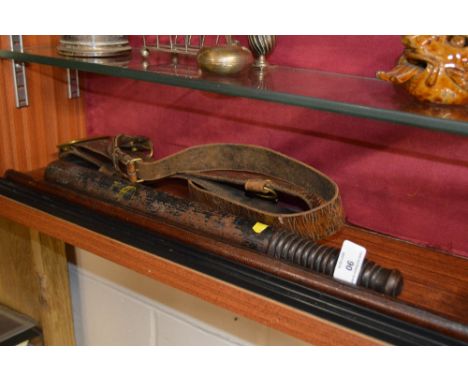 A WW1 Sam Brown leather belt with swagger stick and Special Constabulary Police truncheon 