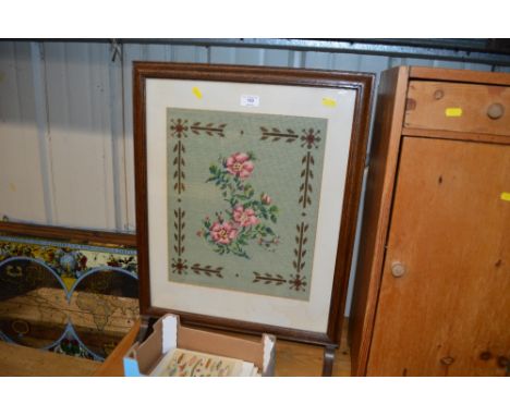 An oak framed and needlework firescreen 