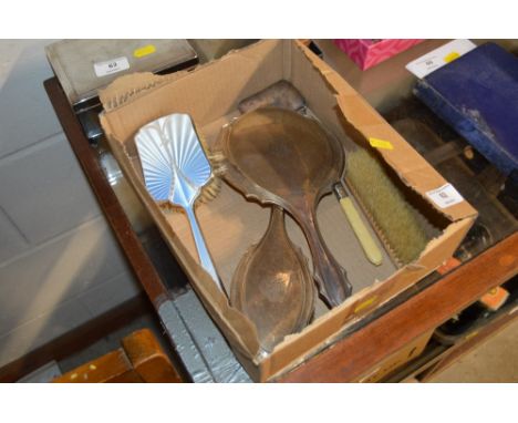 A box of mixed silver to include a blue enamel decorated brush; a ladies purse; a hand mirror etc. 