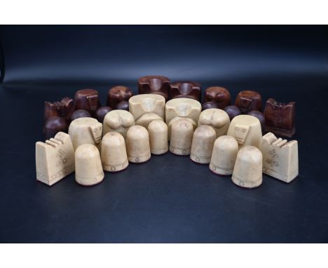 Medieval style chess pieces, height of king 4.8cm  The king and queen are represented as cushioned thrones, the bishops as el