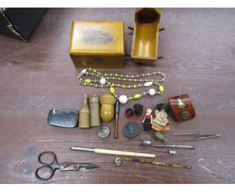 Collectors lot to inc Mauchline ware cot and box, tiny dolls, wooden dice holders with dice, brooch, hat pint (one with turni