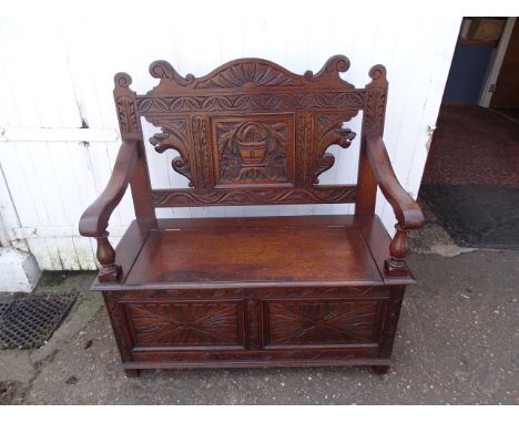 Carved oak settle/Monks bench H111cm W109cm D52cm approx&nbsp;