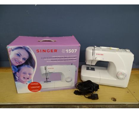 Singer 1507 electric sewing machine from a house clearance and a sewing box with contents&nbsp;